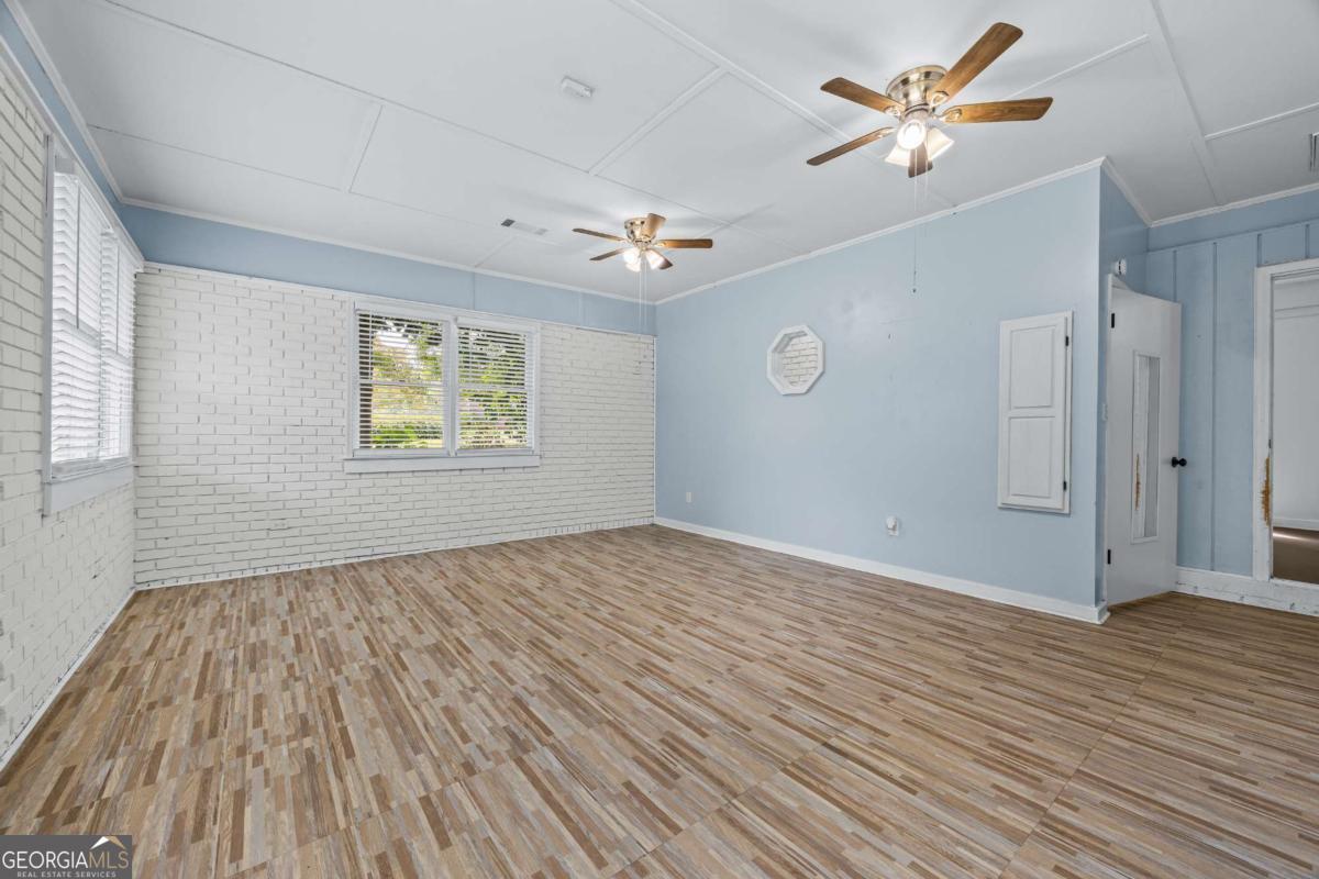 110 Valley Road Toccoa, GA 30577 - Photo 35 of 39 wooden floor in an empty room with a window