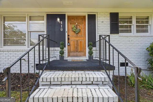 a view of entryway with wooden floor and stairs