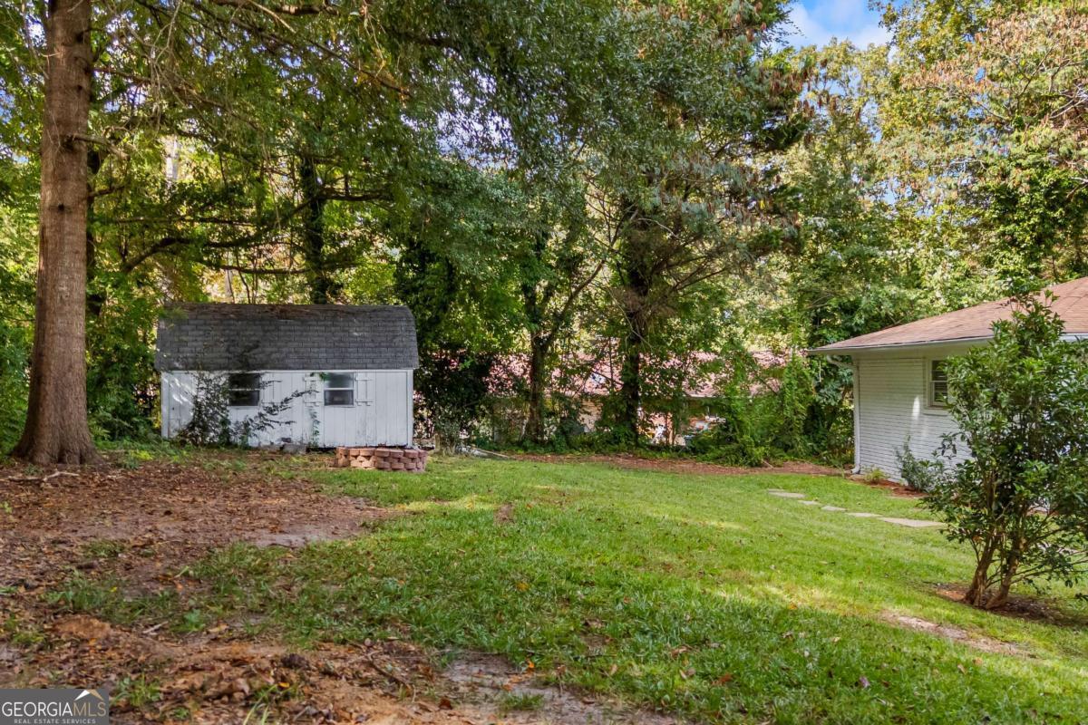 110 Valley Road Toccoa, GA 30577 - Photo 7 of 39 a front view of a house with a garden and tree
