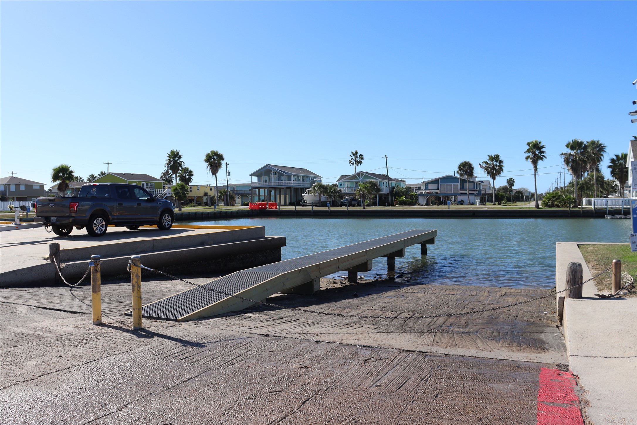4123 Reeves Drive Galveston, TX 77554 - Photo 21 of 28 a view of a terrace with chairs and lake view