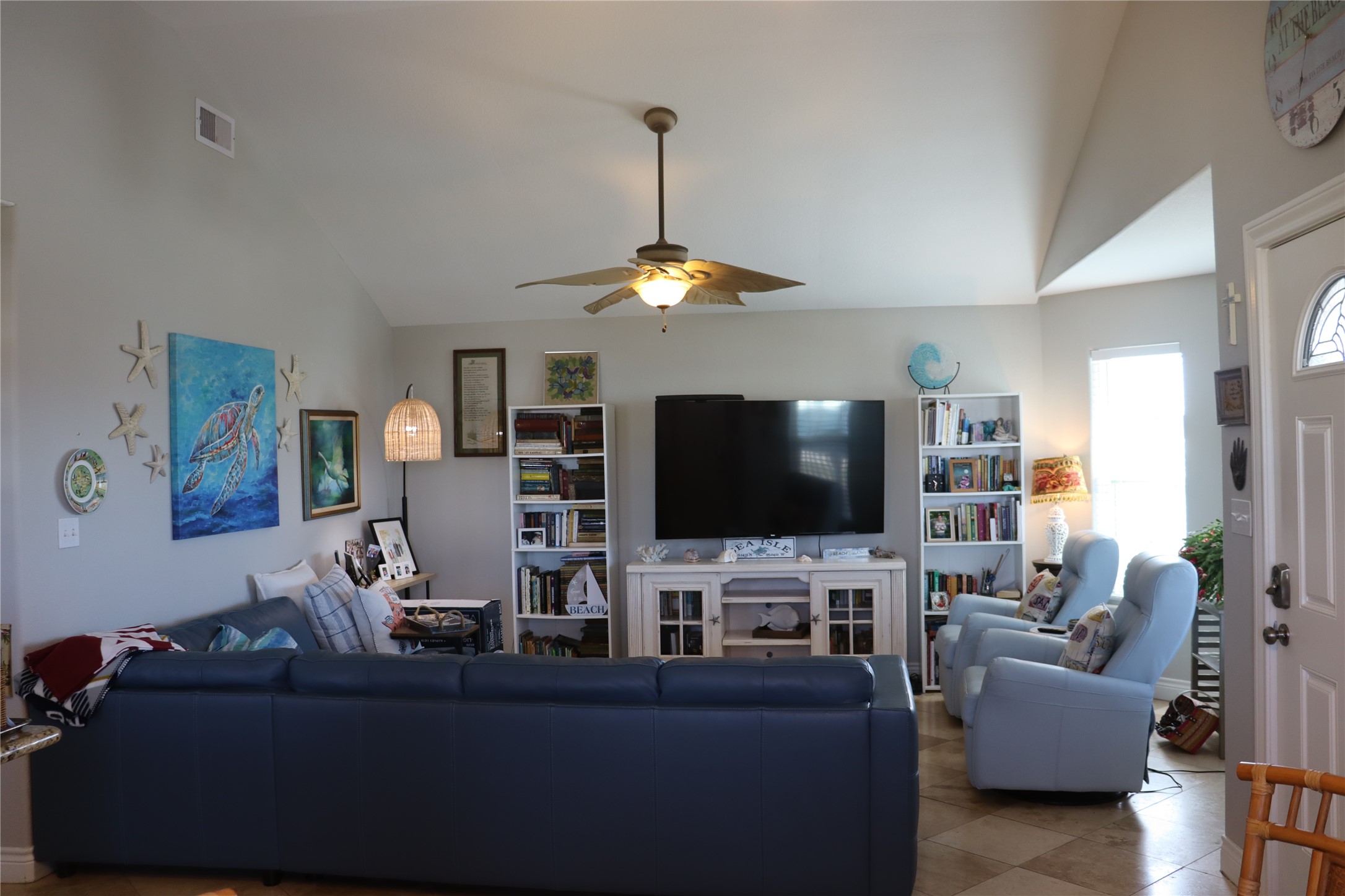 4123 Reeves Drive Galveston, TX 77554 - Photo 3 of 28 a living room with furniture and a flat screen tv