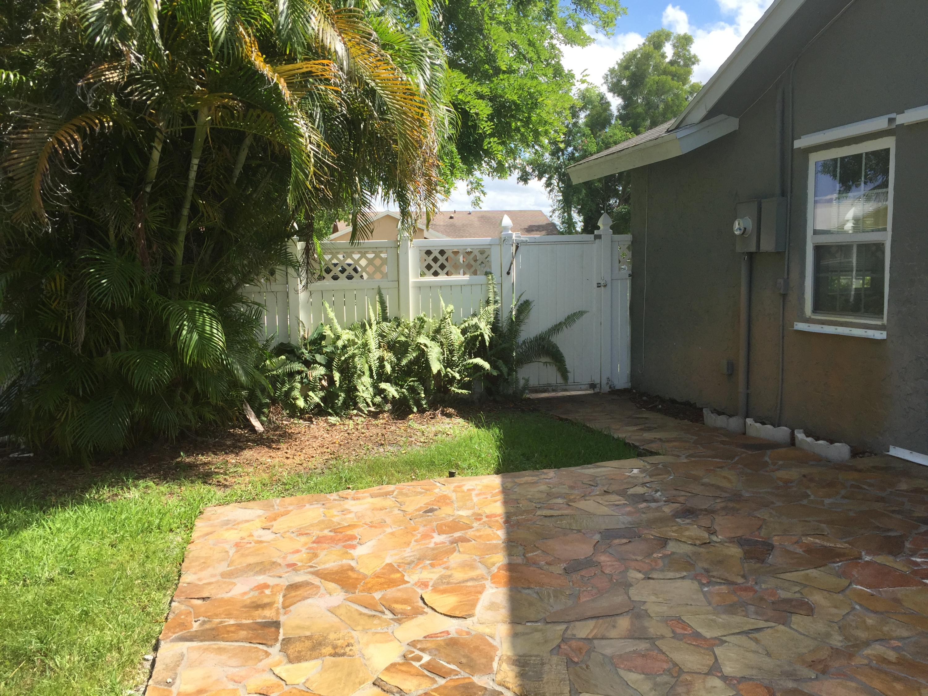 9235 Edgemont Lane Boca Raton, FL 33434 - Photo 21 of 22 Patio and fenced yard