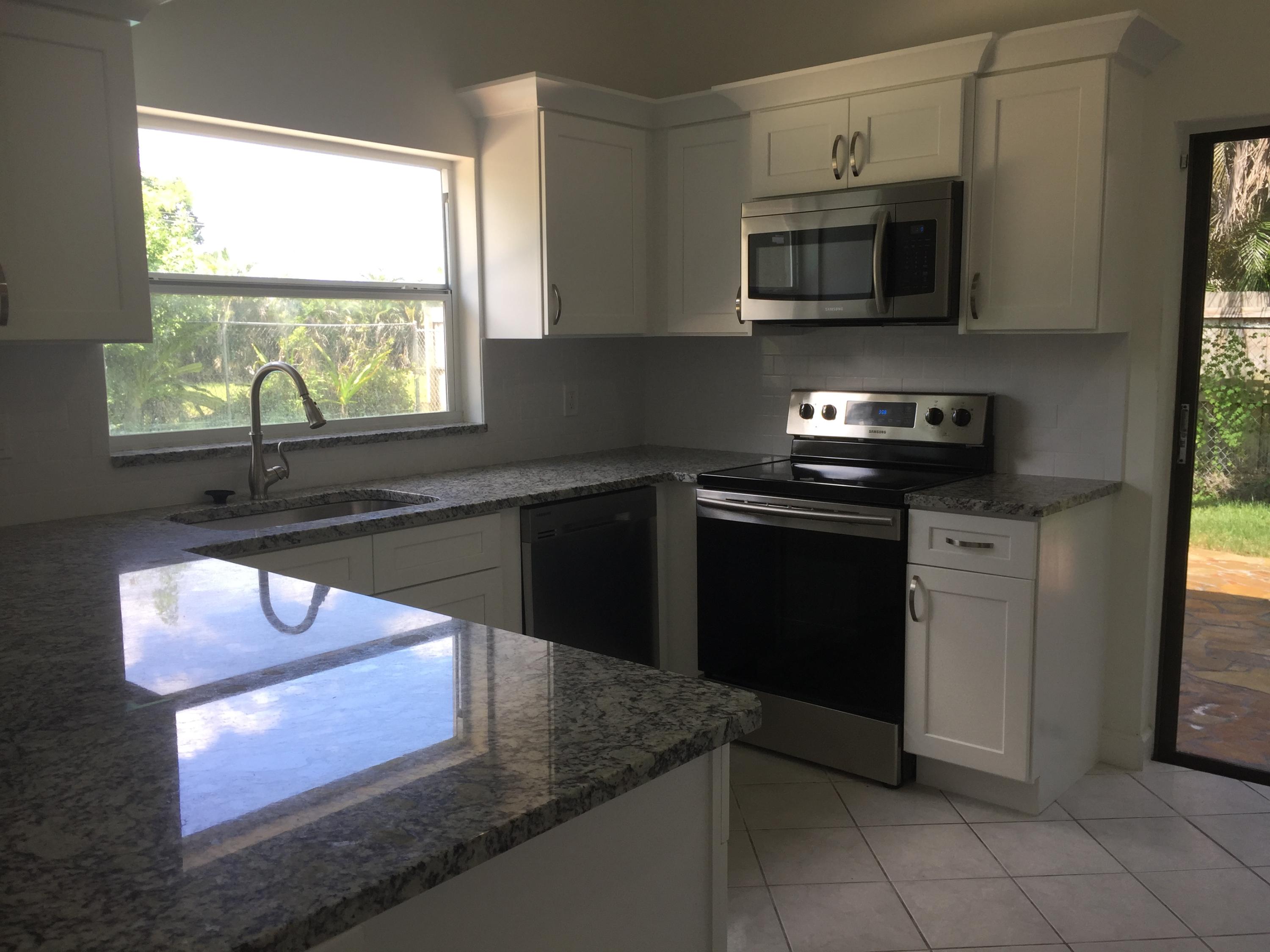 9235 Edgemont Lane Boca Raton, FL 33434 - Photo 7 of 22 kitchen 2