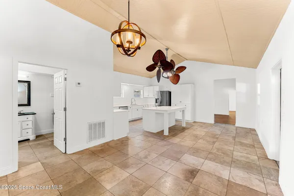a view of a living room and bathroom