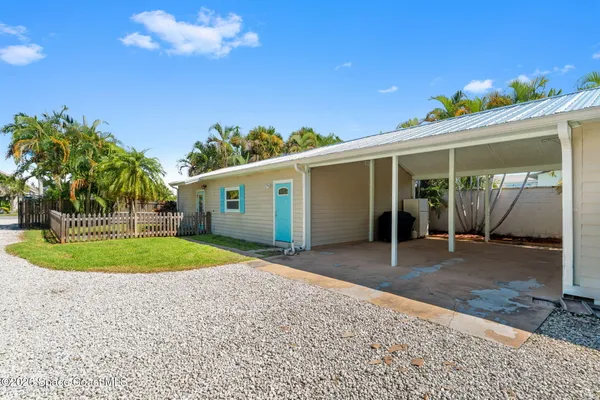 a view of a house with a backyard and porch