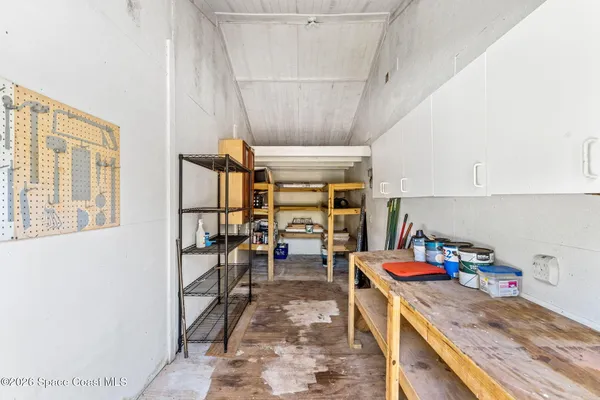 a yellow house in middle of the forest