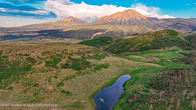 a view of a city with mountains in the background