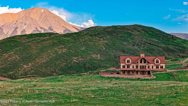 a view of a chairs and table in the garden