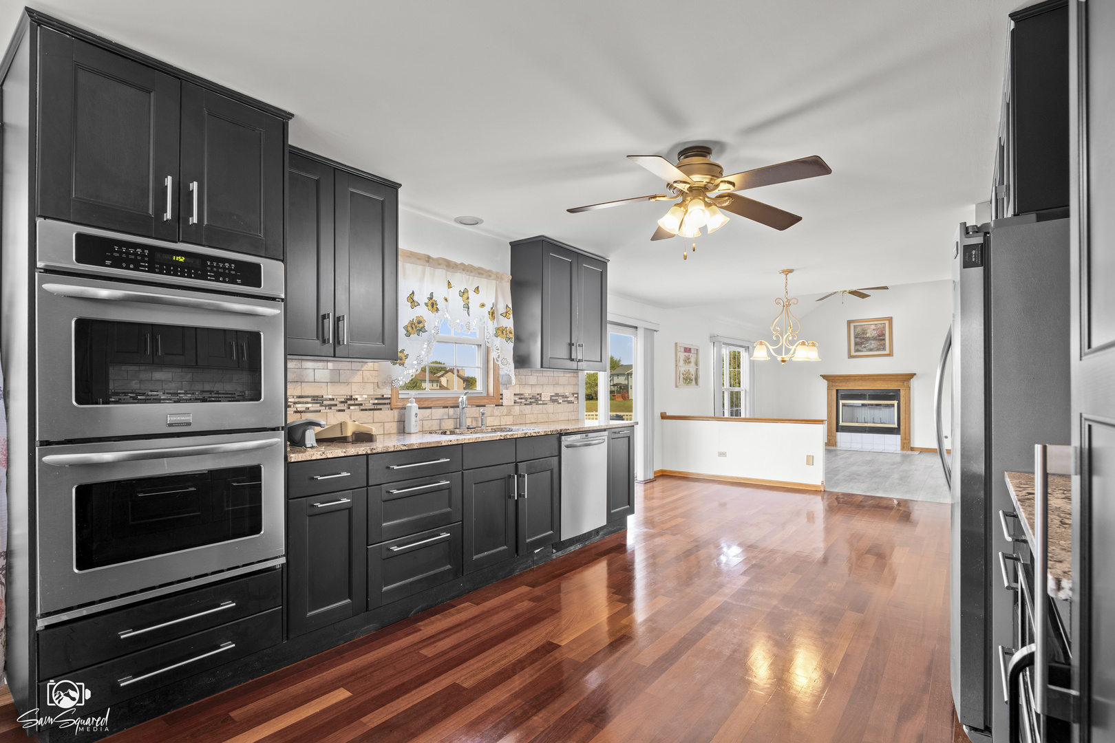 3209 Sunset Court Crest Hill, IL 60403 - Photo 17 of 38 a kitchen with stainless steel appliances granite countertop a stove and a sink with cabinets