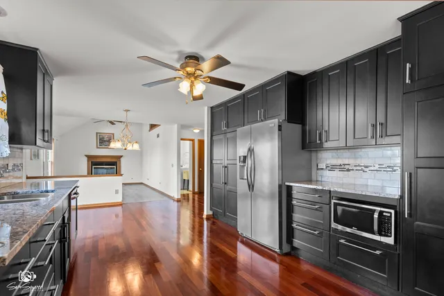a view of a kitchen with granite countertop a counter space