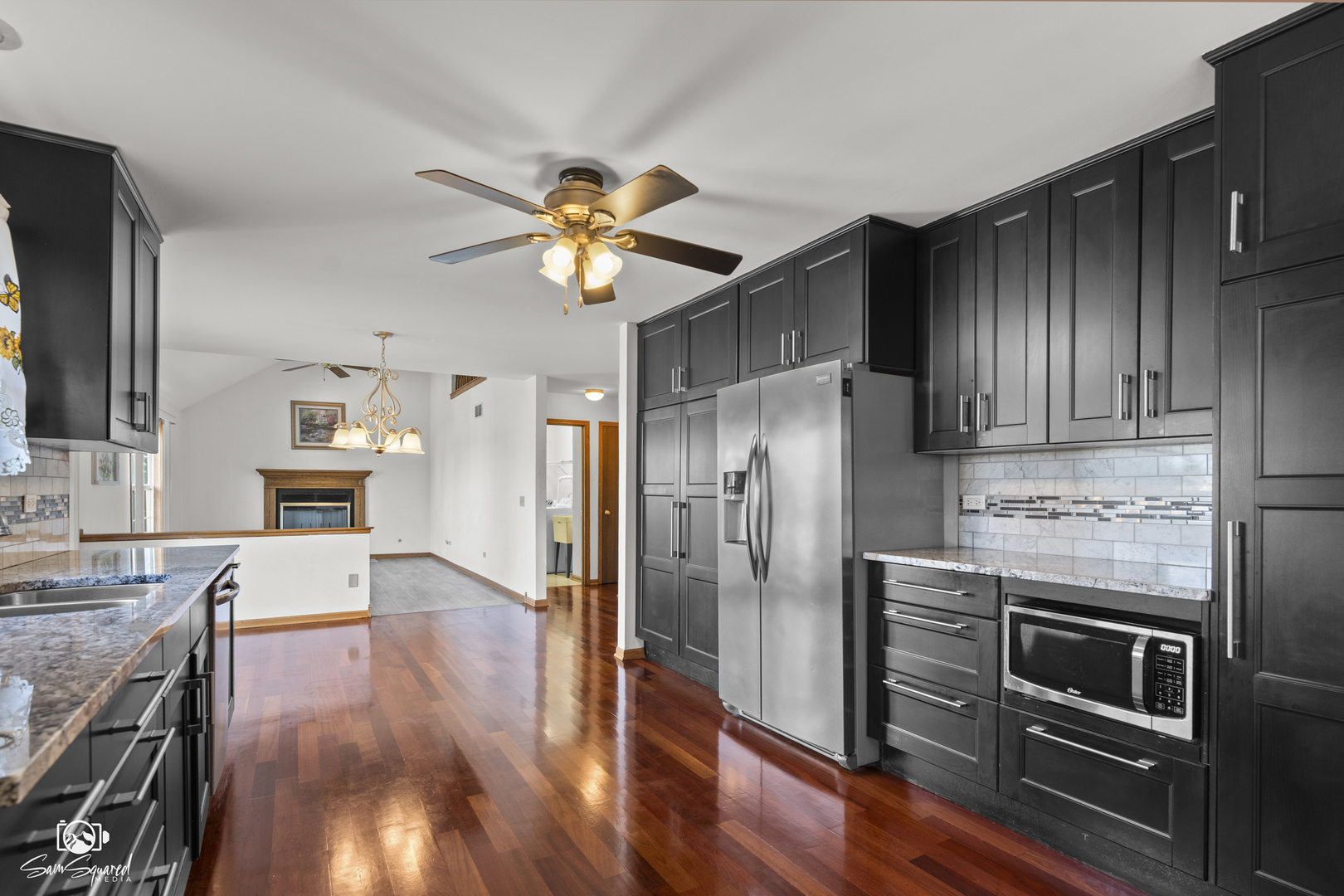 3209 Sunset Court Crest Hill, IL 60403 - Photo 18 of 38 a kitchen with stainless steel appliances a stove a refrigerator and a view of living room