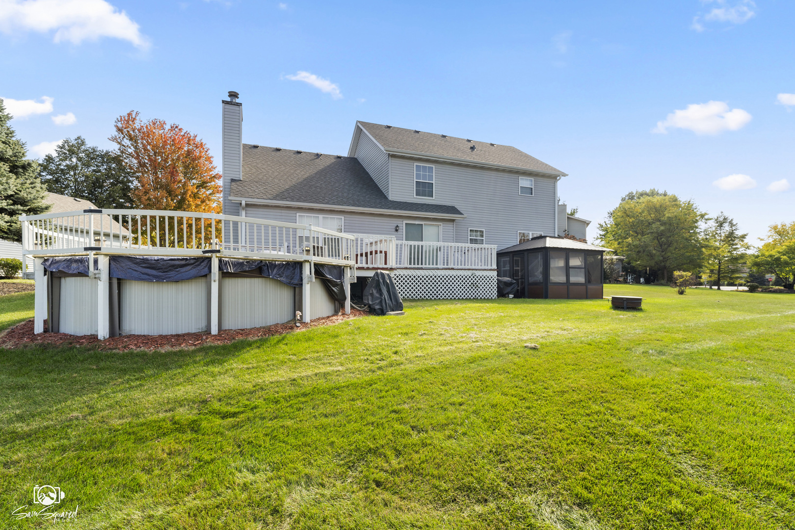 3209 Sunset Court Crest Hill, IL 60403 - Photo 6 of 38 a view of a house with pool and chairs next to a yard
