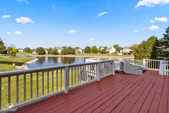 a view of balcony with wooden floor and fence