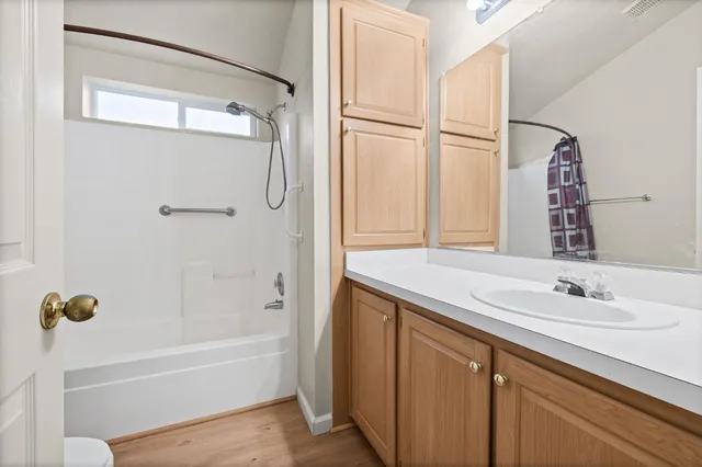 a bathroom with a tub and a sink