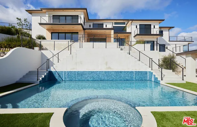 a view of multiple houses with a yard