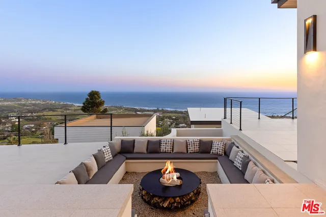 swimming pool view with a seating space