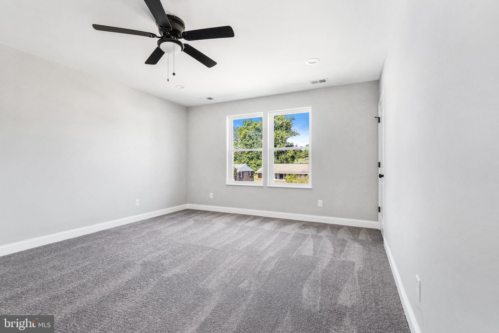 40 Brookside Road Glenside, PA 19038 - Photo 25 of 35 an empty room with windows and ceiling fan