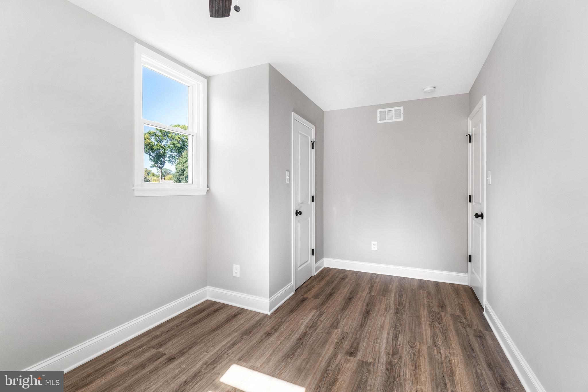40 Brookside Road Glenside, PA 19038 - Photo 26 of 35 an empty room with wooden floor and windows