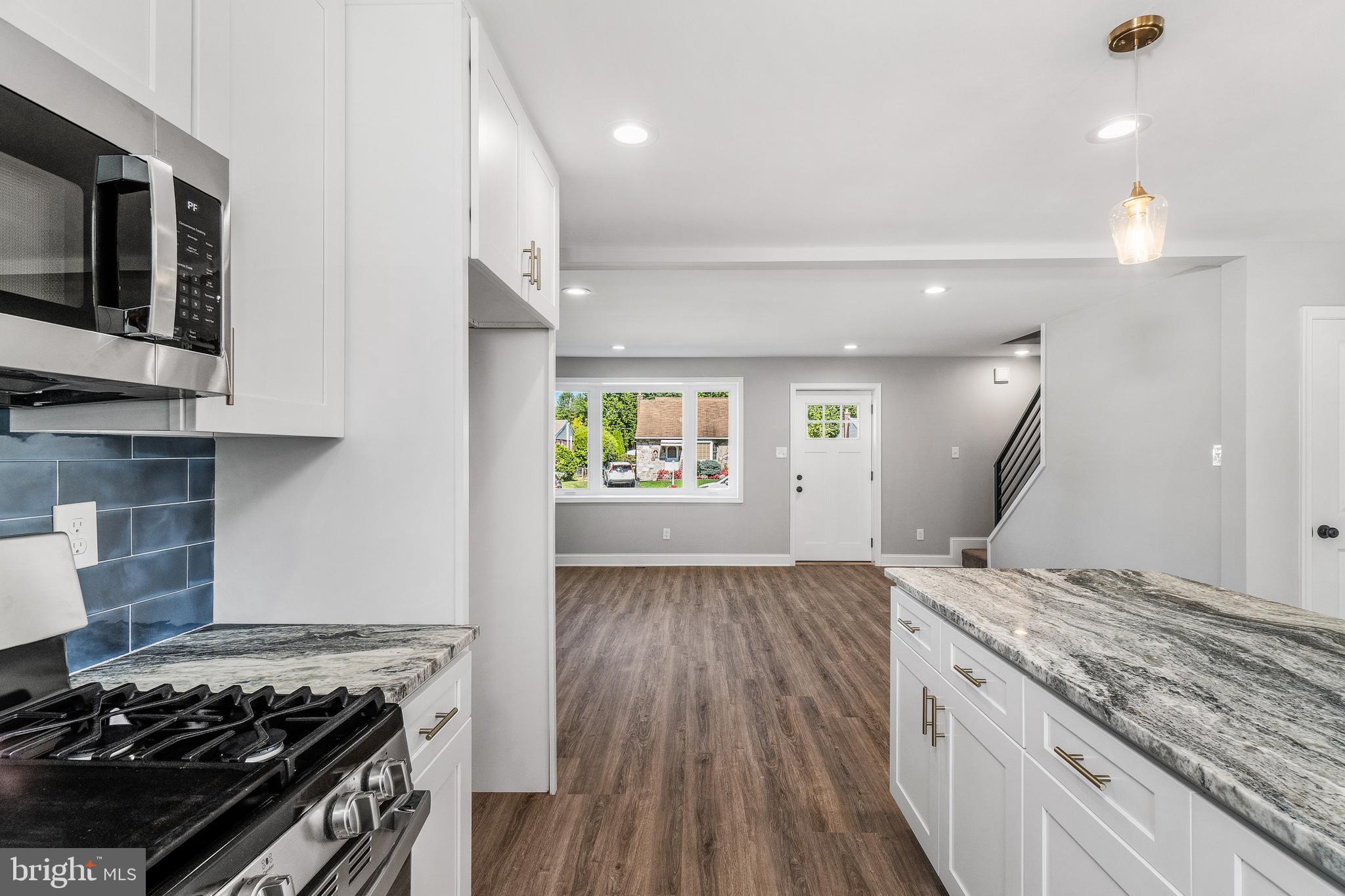 40 Brookside Road Glenside, PA 19038 - Photo 29 of 35 a kitchen with a stove and a wooden floor