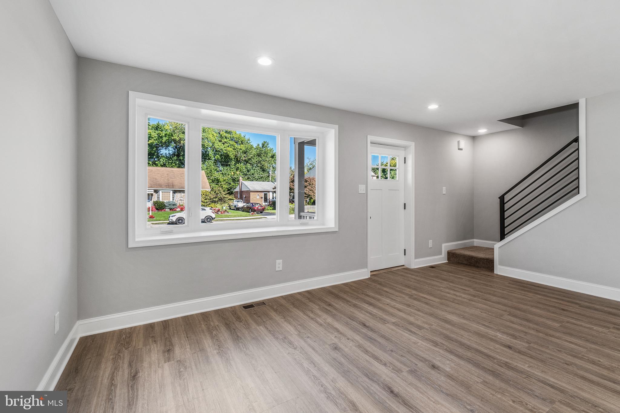 40 Brookside Road Glenside, PA 19038 - Photo 7 of 35 an empty room with wooden floor and windows