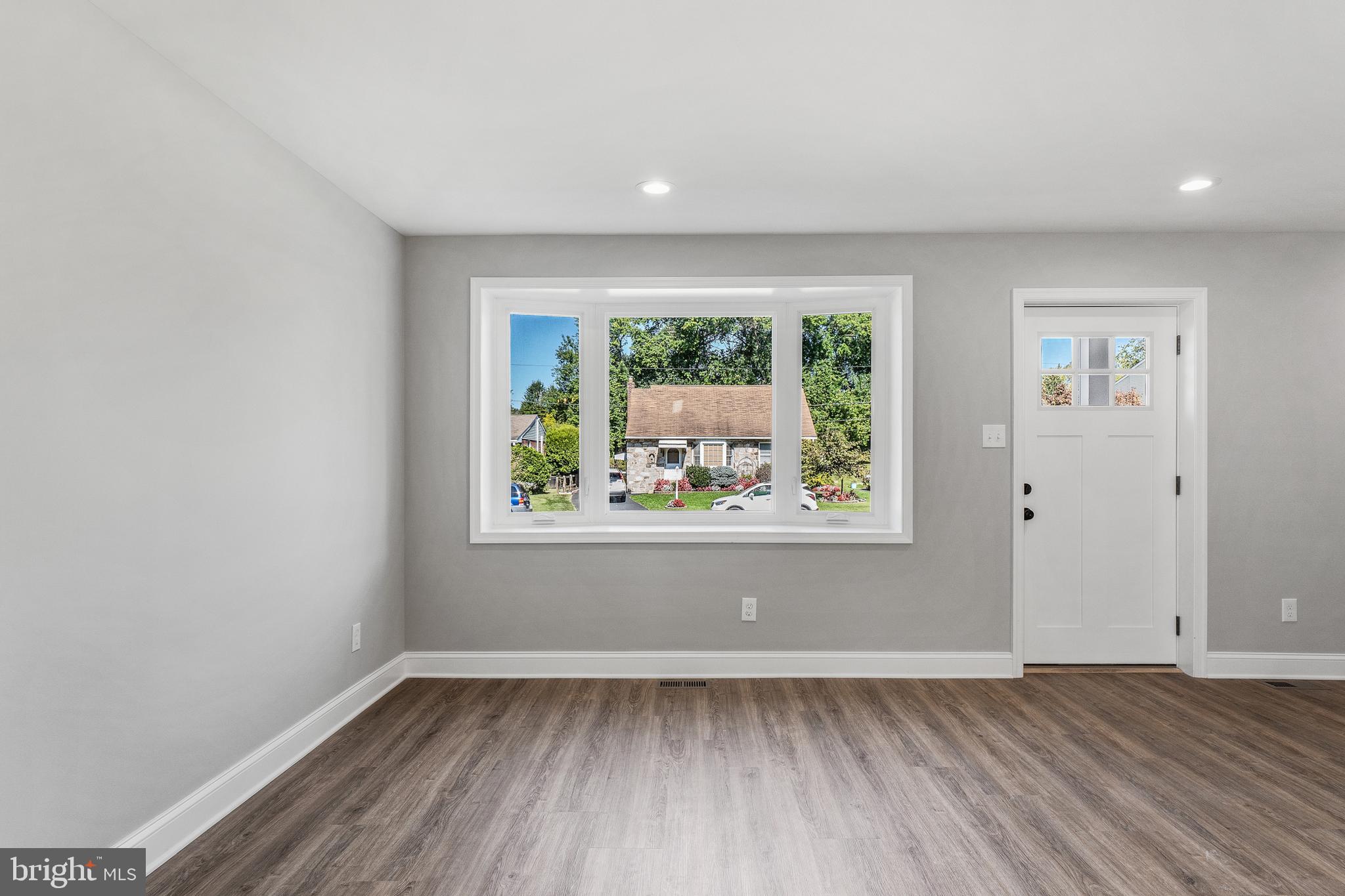 40 Brookside Road Glenside, PA 19038 - Photo 8 of 35 an empty room with wooden floor and window