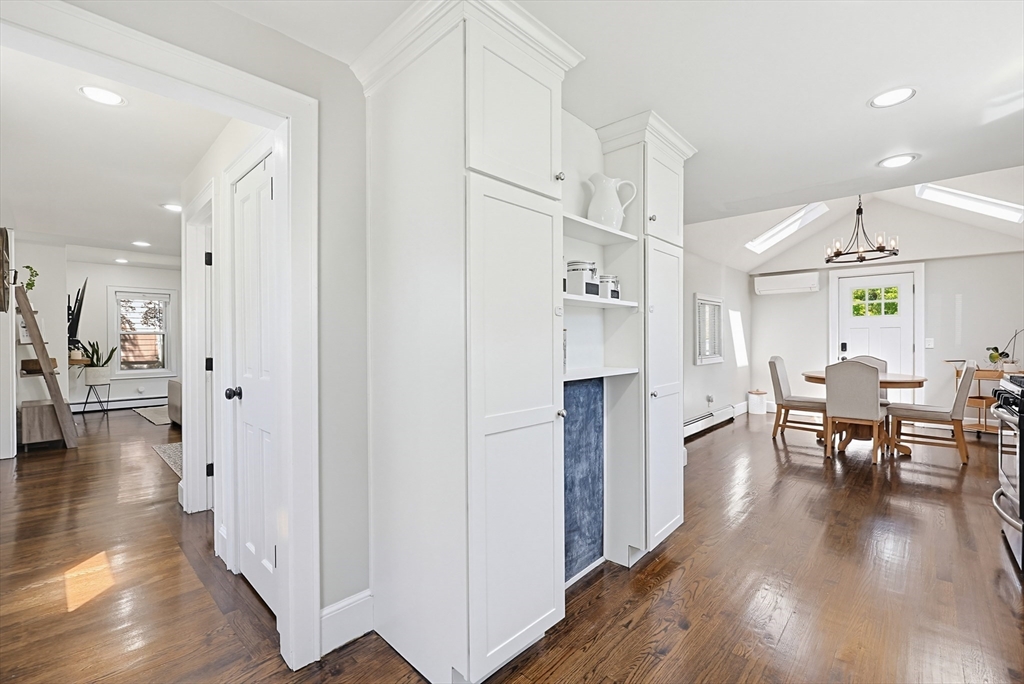 345 Sherman Street Canton, MA 02021 - Photo 12 of 42 a kitchen with stainless steel appliances refrigerator dining table and chairs