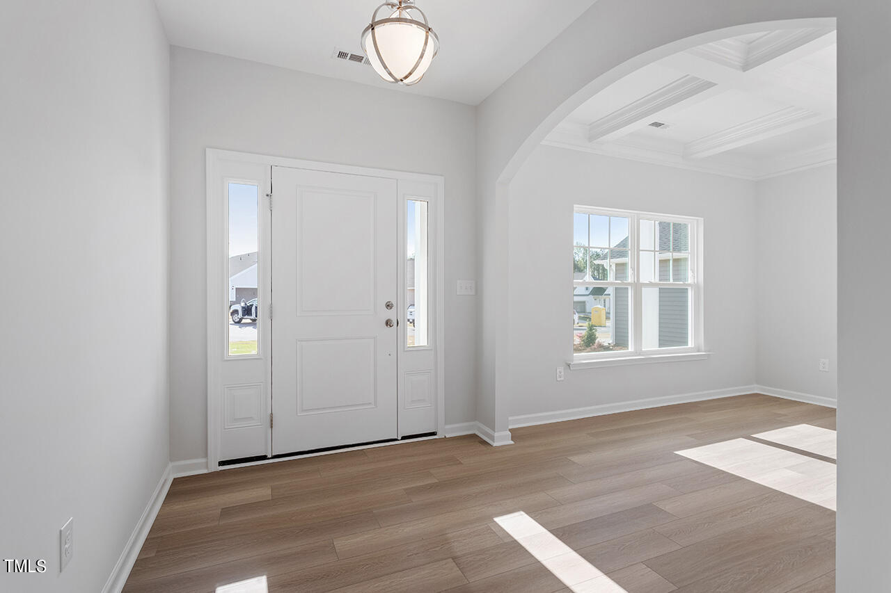 63 Beech Tree Way, Unit 139 Garner, NC 27529 - Photo 3 of 25 an empty room with windows