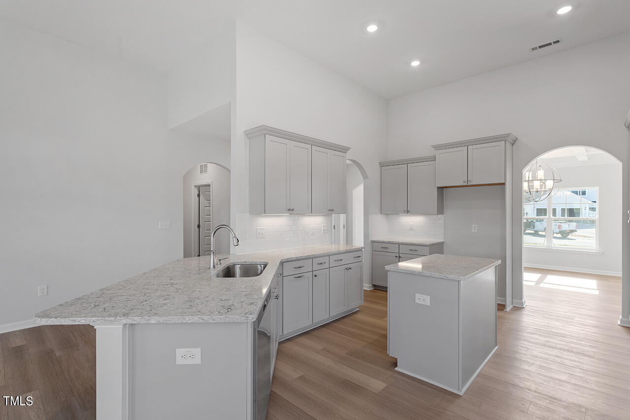 63 Beech Tree Way, Unit 139 Garner, NC 27529 - Photo 9 of 25 a kitchen that has a lot of cabinets in it