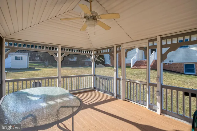a view of a porch with wooden floor