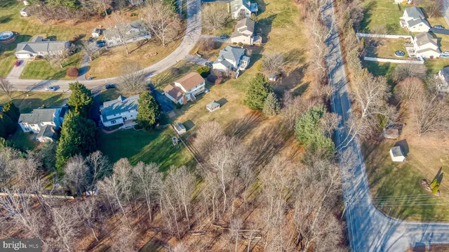 a view of backyard with swimming pool