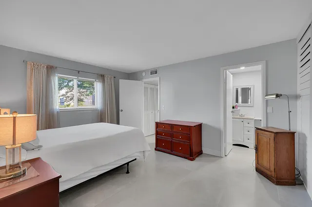 a bedroom with furniture and window