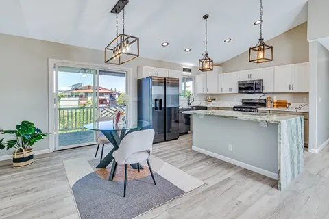 a view of a kitchen and dining room