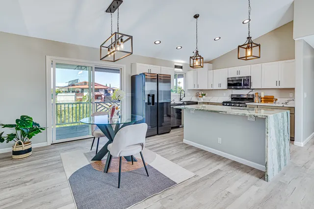 a view of a kitchen and dining room