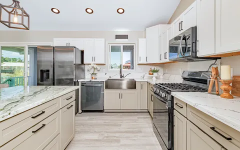 a kitchen with a sink stove and refrigerator