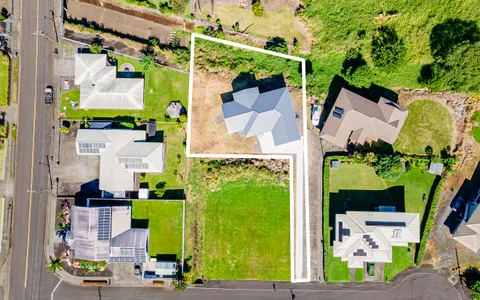 an aerial view of houses with outdoor space