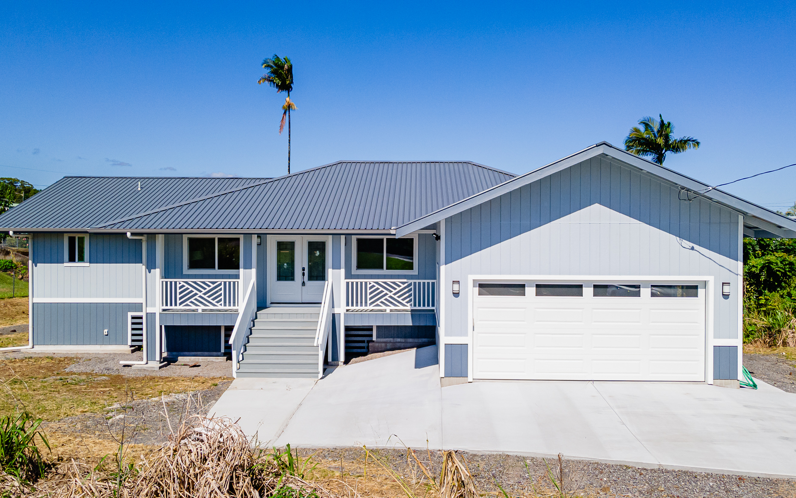 508 Ekela Street Hilo, HI 96720 - Photo 3 of 30 a front view of a house with a yard and garage