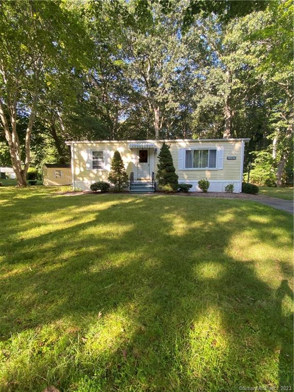 36 Stone Hedge Road Westbrook, CT 06498 - Photo 1 of 1 a view of a house with a big yard and large trees