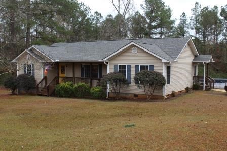 222 Reedy Creek Road Forsyth, GA 31029 - Photo 2 of 15 a view of a house with a yard and large tree