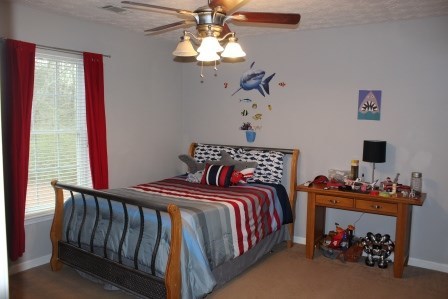 222 Reedy Creek Road Forsyth, GA 31029 - Photo 12 of 15 a bedroom with bed and a window