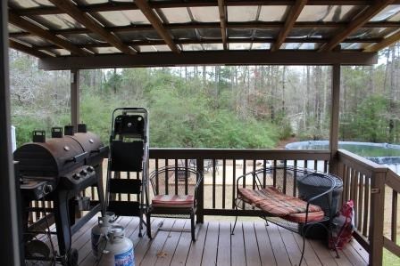 222 Reedy Creek Road Forsyth, GA 31029 - Photo 13 of 15 a view of a porch with furniture and wooden floor