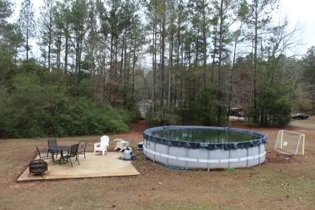 222 Reedy Creek Road Forsyth, GA 31029 - Photo 14 of 15 a view of a swimming pool with a patio