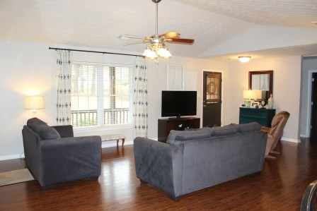 222 Reedy Creek Road Forsyth, GA 31029 - Photo 4 of 15 a living room with furniture a flat screen tv and a large window