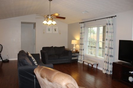 222 Reedy Creek Road Forsyth, GA 31029 - Photo 5 of 15 a living room with furniture a flat screen tv and a large window