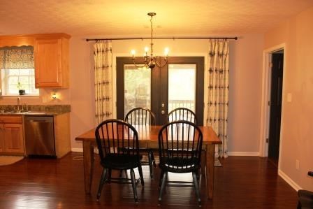 222 Reedy Creek Road Forsyth, GA 31029 - Photo 8 of 15 a view of a a dining room with furniture window and wooden floor