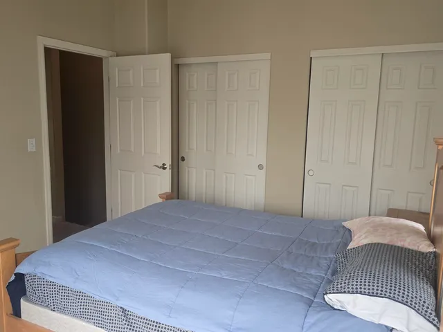 a view of a bedroom with cabinet