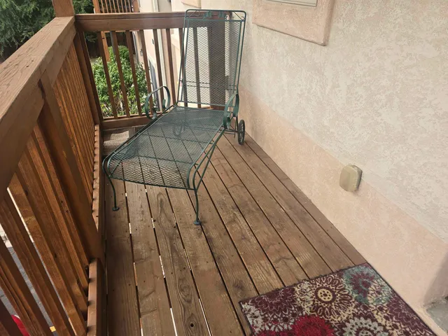 a view of balcony with wooden floor