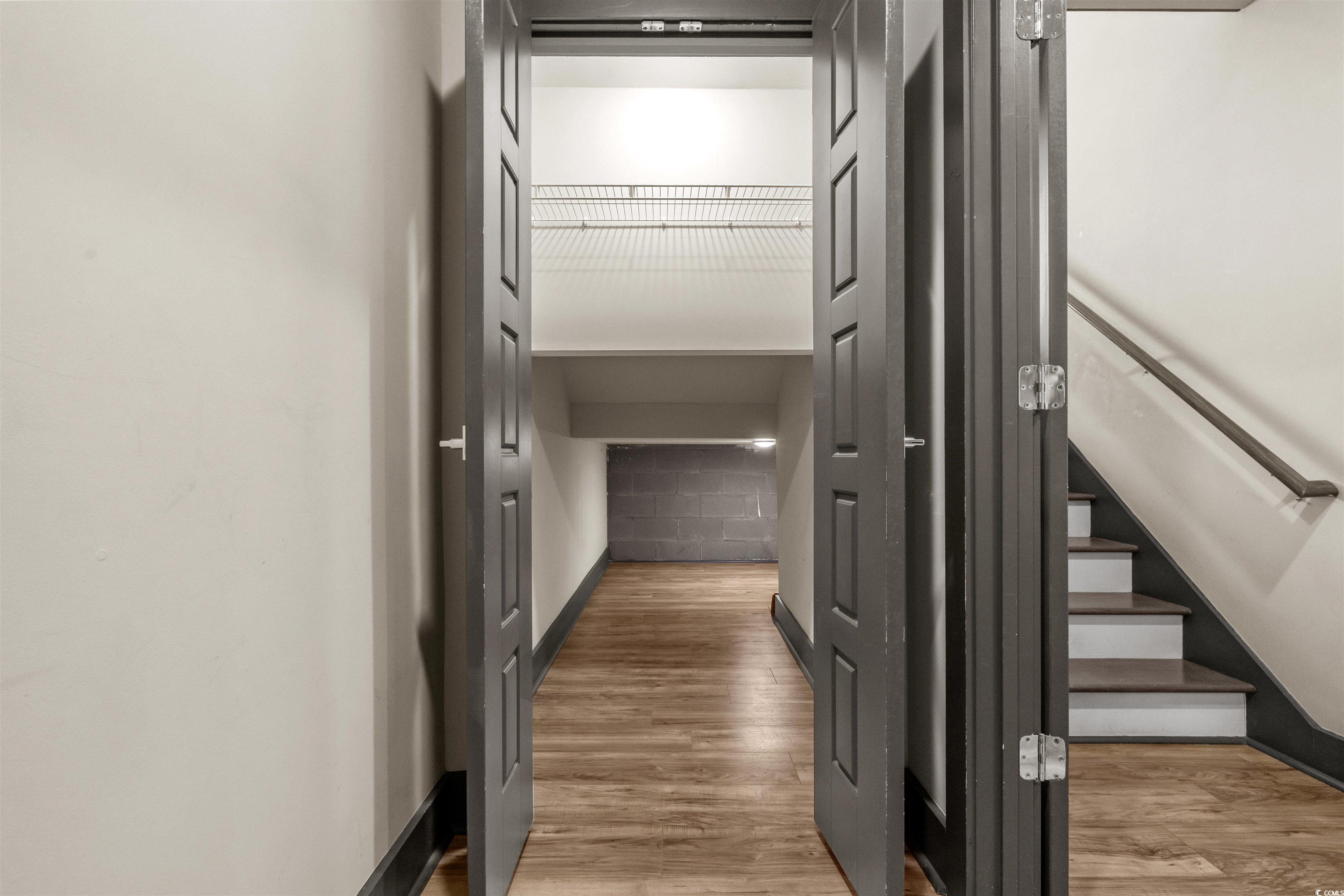 80 Shady Oak Lane Murrells Inlet, SC 29576 - Photo 18 of 31 Hall with light wood-style flooring and baseboards