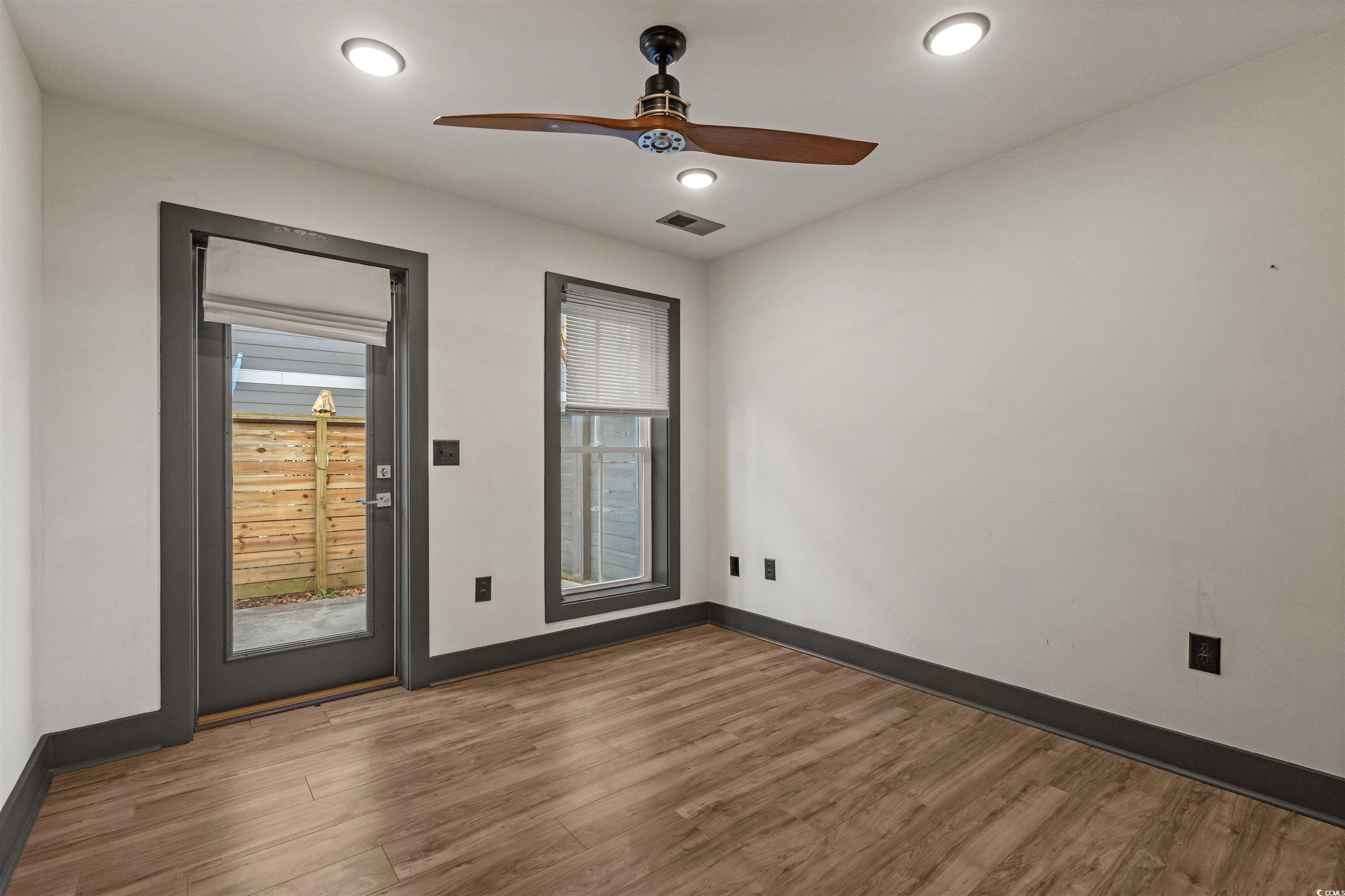 80 Shady Oak Lane Murrells Inlet, SC 29576 - Photo 19 of 31 Unfurnished room with a ceiling fan and wood finished floors
