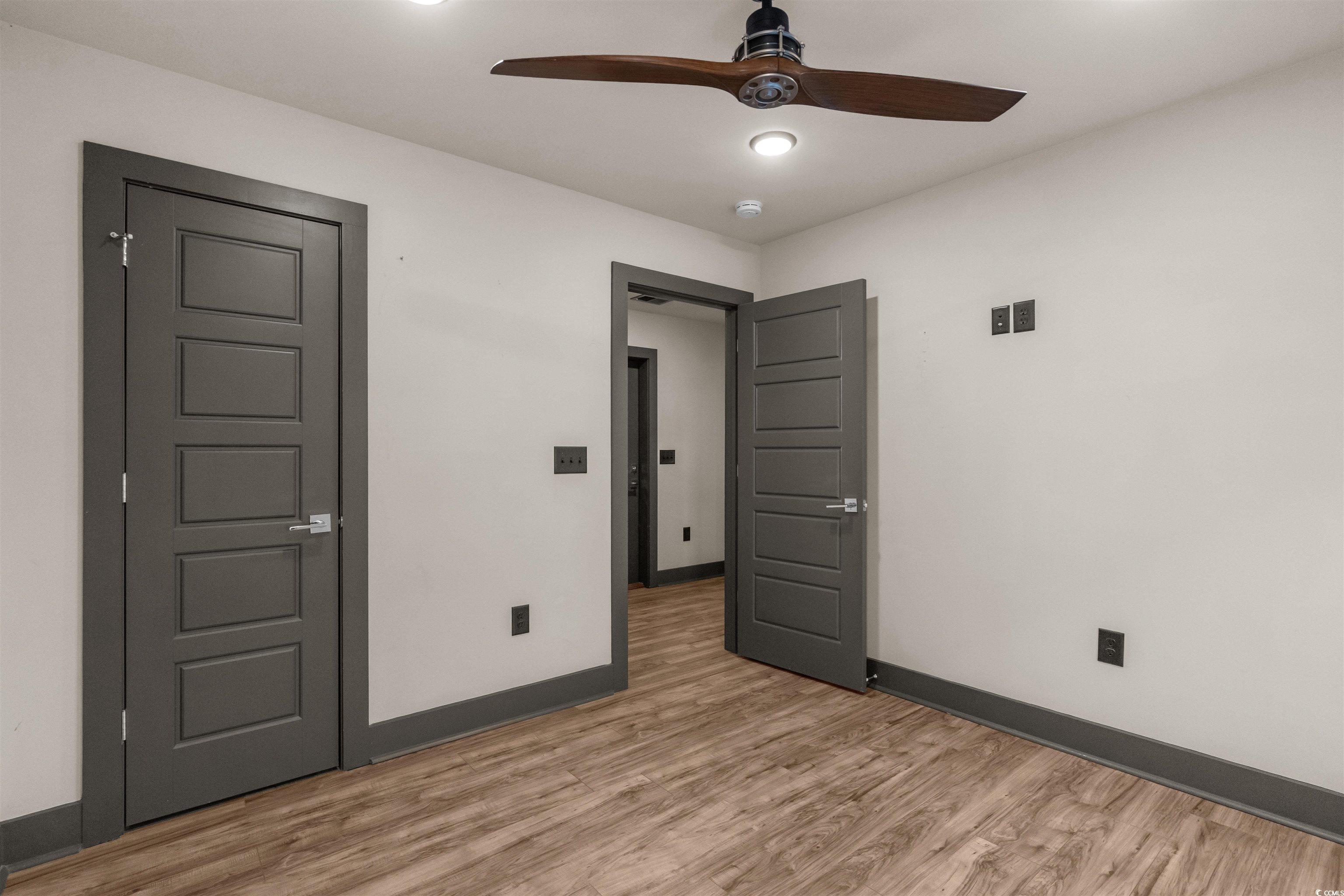 80 Shady Oak Lane Murrells Inlet, SC 29576 - Photo 20 of 31 Unfurnished bedroom with light wood-style floors and ceiling fan