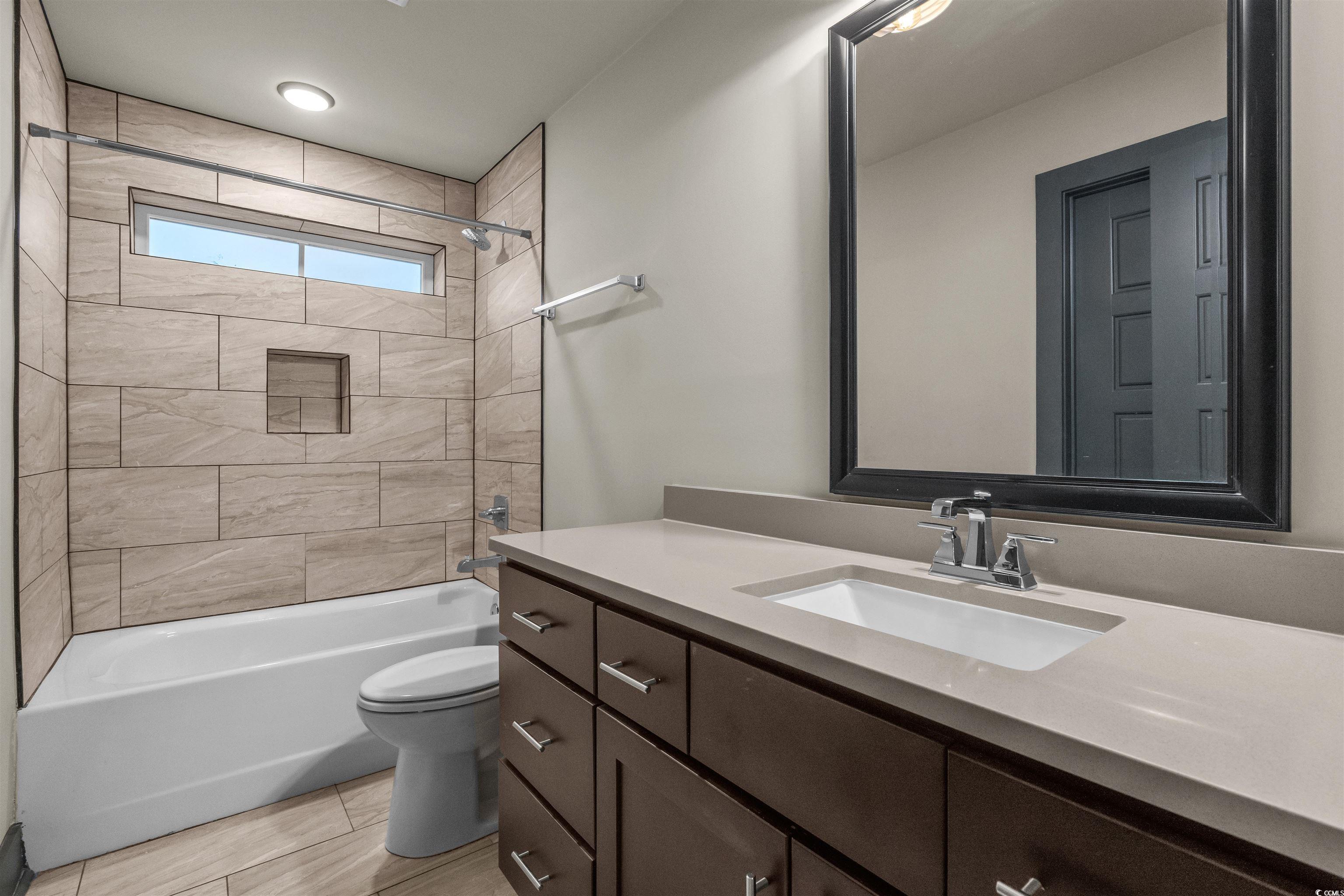 80 Shady Oak Lane Murrells Inlet, SC 29576 - Photo 23 of 31 Bathroom with shower / bathtub combination and vanity